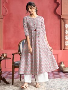 This Green Ethnic Floral Printed Pin Tuck A-Line Kurta is a timeless piece designed for special occasions. It features a classic round neck and three-quarter sleeves, with a flared hem that falls below the calf. The two types of pin-tuck detail with wooden buttons and fringes ensure a flattering silhouette, making it the perfect choice for any celebration. For a complete look, pair it with matching pants, a contrasting dupatta, and minimal jewelry